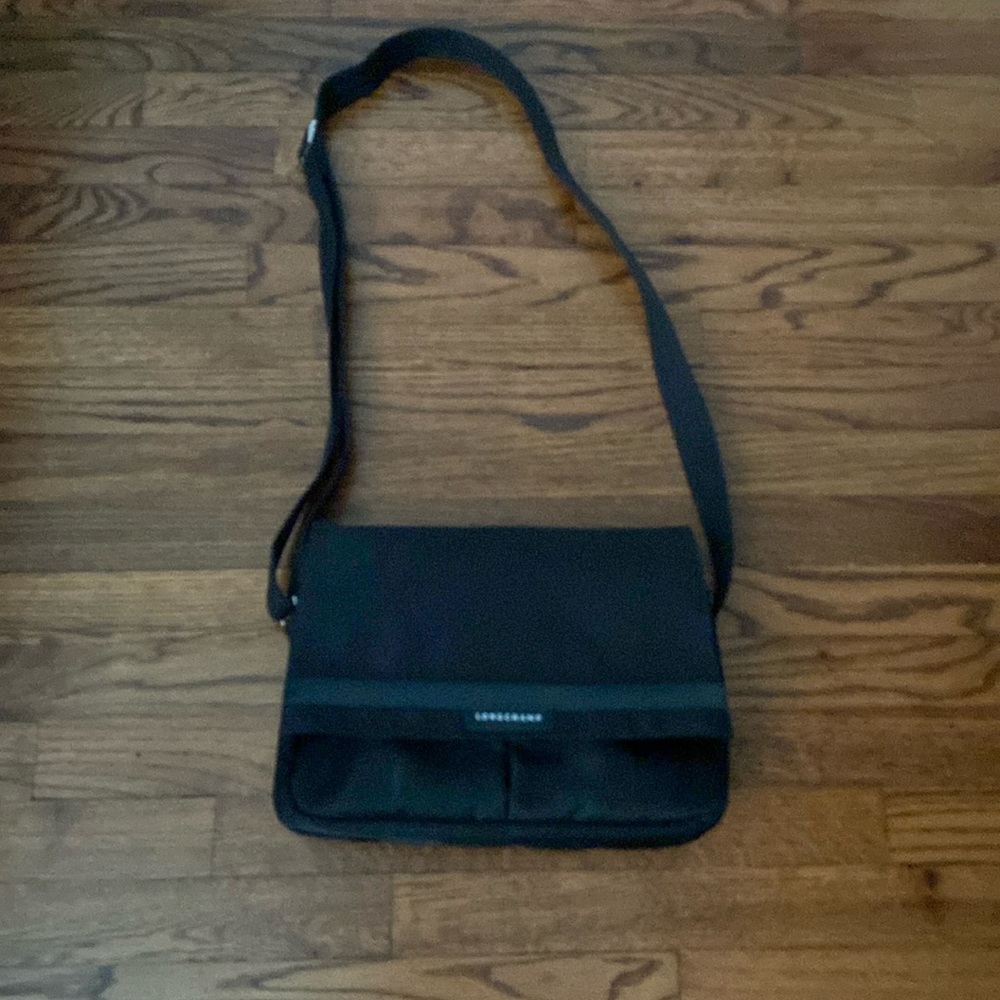 Longchamps canvas crossbody bag.